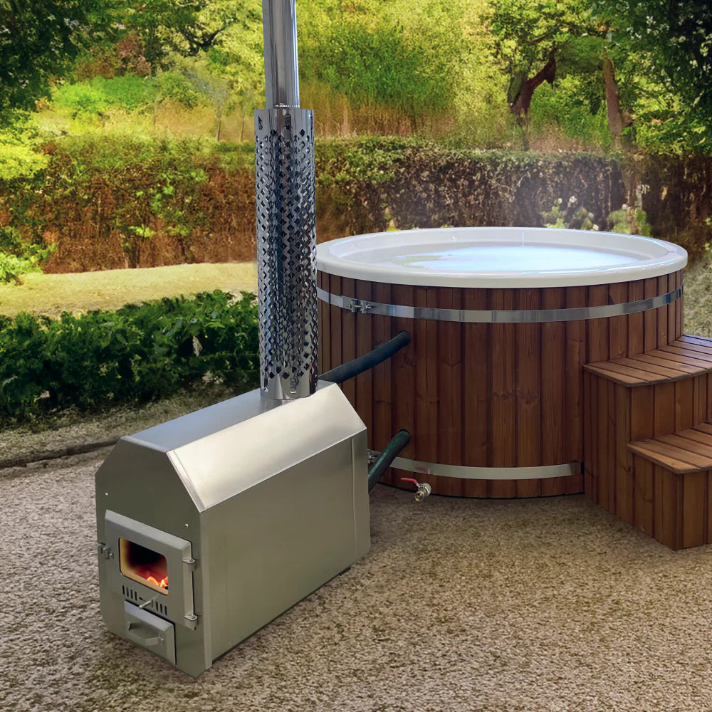 Outdoor view of wood fired hot tub with stainless steel integrated stove, wooden steps, surrounded by greenery and trees