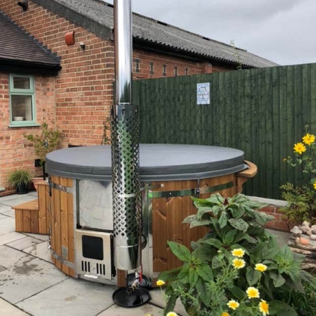 Customer's photo with a private wood-fired hot tub from Gardenvity