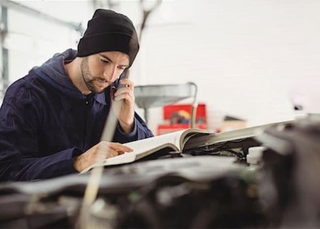 A man checking maintenance tasks