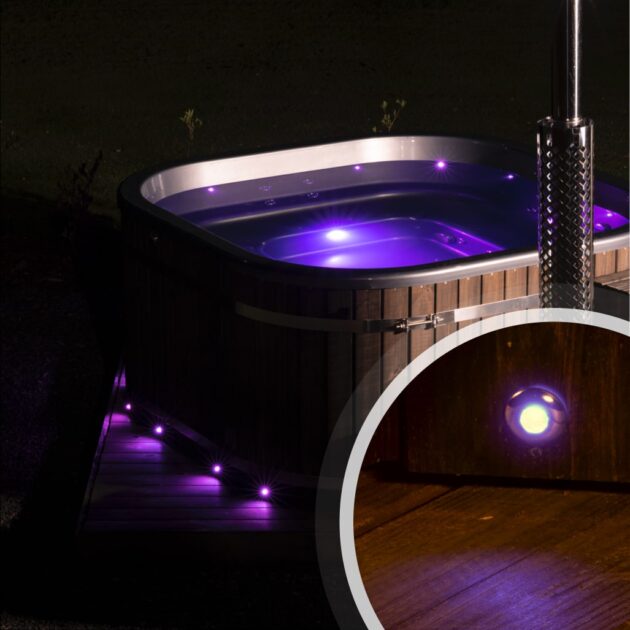A wood-fired hot tub that glows with purple LEDs on the outside and inside